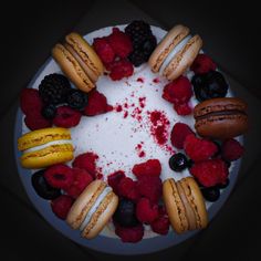 a white cake topped with lots of different types of desserts