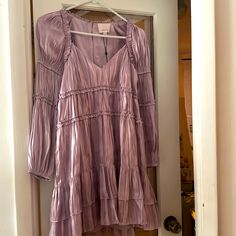 Size 2 With Zipper Back And Puff Sleeves. Never Worn And With Tags. Purple Puff Sleeve Dress For Fall, Lavender Long Sleeve Dress For Fall, Long Sleeve Lavender Dress With Ruffles, Lavender Long Sleeve Ruffle Dress, Lavender Long Sleeve Ruffled Dress, Lavender Ruffled Long Sleeve Dress, Kiki Dress, Silk Formal Dress, Mesh Panel Dress