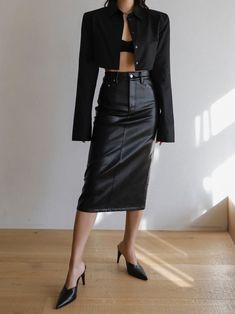 Slim fit pencil vegan leather skirt. Hugging silhouette with button and zipper closure. Midi length. Model is in MINUSEY S. ✔️ Free worldwide express shipping over $100✔️ Loved by 6,500+ customers✔️ Limited edition collections, maximum style⠀⠀⠀⠀⠀⠀⠀⠀⠀Stay ahead of the trend with can’t-find-anywhere-else staples. Your closet will thank you 💕 * MINUSEY S = EU 34, US 2* MINUSEY M = EU 36, US 4* 65% Polyester / 35% Rayon* Dry clean* Made in Korea - Model Height: 172cm/5'7" (US2, EU34) Black Pencil Skirt With Button Closure For Work, Office Pencil Skirt With Button Closure, Sleek Fall Office Pencil Skirt, Black Pencil Skirt For Office Wear In Fall, Vegan Leather Midi Skirt, Cropped Button Down, Vegan Leather Skirt, Hugging Silhouette, Leather Midi Skirt