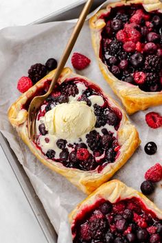 homemade mixed berry puff pastry tarts with ice cream on top