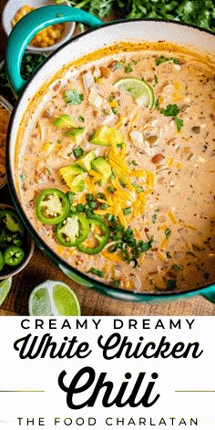 creamy creamy white chicken chili in a blue pot with limes and cilantro