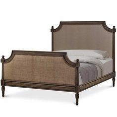 a bed with an upholstered headboard and foot board, made from wood