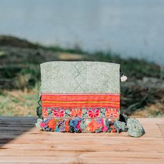 This beautiful crossbody bag is made with an amazing piece of fabric woven by the HMONG hill tribes of Lanna Country (Northern Thailand). It has multi pom pom tassels and It's a great bag for carrying anything. It features a zippered opening area and inside zippered pocket. We buy materials from Hmong market and we design and sew by hand. Some of the bags we modify to improve the product. The Hmong tribes live in the North of Thailand and have origins from the Tibetan area of China. ------------ Green Rectangular Shoulder Bag For Festival, Green Embroidered Crossbody Shoulder Bag, Handwoven Green Shoulder Bag For Festivals, Green Woven Shoulder Bag For Festivals, Green Bohemian Bags For Festivals, Bohemian Green Shoulder Bag With Removable Pouch, Traditional Green Shoulder Bag For Festival, Green Crossbody Bag For Festival, Green Crossbody Shoulder Bag For Festivals