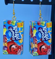 These cute kool aid jammer earrings are the perfect way to show off your fun side. Each kool aid jammer box dangles from a hypoallergenic hook earring Silly Earrings, Lesbian Earrings, Crazy Earrings, Brand Earrings, Weird Jewelry, Funny Earrings, Quirky Earrings, Candy Jewelry, Food Earrings