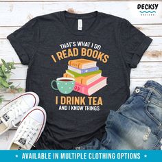 Slip into book-lover-style and sip your favorite tea with this Book Lover Shirt! Perfect as a gift for any tea-lover, this shirt will keep you feeling cozy and reading-ready. It's sure to bring a smile to the bibliophile in your life! I READ BOOKS I DRINK TEA AND I KNOW THINGS ★ UNISEX TSHIRT, WOMENS’ TEE, LONG SLEEVE SHIRT, TANK TOP, CREWNECK SWEATSHIRT JUMPER, HOODIE PULLOVER SWEATER ★ Lover Style, Librarian Shirt, Drink Tea, Coffee Shirt, Book Shirts, Coffee Shirts, Hoodie Pullover, Unisex Tshirt, Tea Lover