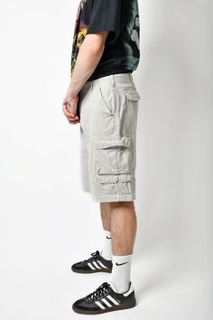 🚀Need to get your order super fast? Choose DHL Express shipping upgrade in your cart. It takes only 1-2 b. days to European Union countries and 2-5 b. days to USA, Canada and all other countries. Orders are ready to ship in 1 b. day. 🔥Multi pocket cargo Y2K men's long shorts in beige/grey colour. Size - M (33). Model is 177 cm / 5ft 9.6" tall and usually wears size M. Very good vintage condition. Only 1 available! All orders are shipped every day Worldwide from 🇪🇺EU. Safe registered standard Gray Cargo Shorts With Pockets For Outdoor Activities, Gray Cargo Shorts With Pockets For Outdoor, Gray Cargo Pants With Pockets For Summer, Summer Gray Cargo Pants With Cargo Pockets, Summer Cargo Shorts With Multiple Pockets For Outdoor Activities, Beige Summer Cargo Pants For Outdoor Activities, Bermuda Cargo Shorts With Multiple Pockets For Summer, Summer Bermuda Cargo Shorts With Multiple Pockets, Gray Cotton Shorts For Outdoor Activities