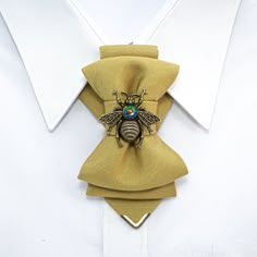 "HOPPER TIE \"HONEY\" is a sunny accent to your wardrobe. Honney yellow or khaki tie, decorated with small brass-colored metal edge and a metal bee pin. It is easy to wear with it with many varicolored clothes. This bright accessory will bring sunshine everywhere you go. The most important feature of the accessory for women - versatility! It, in addition to the usual way, can also be worn as a brooch and as a pendant (by inserting an existing chain, bow, etc. into its upper fold). This unique pr Fashion Design Accessories, Bow Tie Accessories, Fabric Accessories Fashion, Simpul Dasi, Metal Bee, Unique Bow Tie, Necktie Crafts, Tie Ideas, Bee Pin