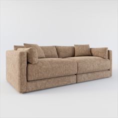 a brown couch with pillows sitting on it's back end and the seat up