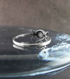 Material: 100% Sterling silver Weight: 1.6 grams Triple Moon is almost 3/8 inch wide x 1/4 inch tall (12 x 6 mm) Band is 1/16 inch wide (2mm) Item number: wh238 A symbol within a symbol gives this attractive ring added interest. The overall form is that of the well-known Triple Moon which symbolizes the three traditional phases of life in females: Maiden, Mother, and Crone. Within the central full moon (Mother) is inscribed Hecate's Wheel, which is another symbol of womanhood and its three phase Silver Crescent Rings Nickel Free, Nickel Free Silver Crescent Rings, Nickel-free Silver Crescent Rings, Symbolic Moon-shaped Promise Ring, Symbolic Moon Shaped Promise Ring, Symbolic Silver Hypoallergenic Rings, Symbolic Silver Moon-shaped Ring, Silver Moon Shaped Symbolic Ring, Silver Moon-shaped Symbolic Ring