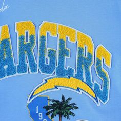 Designed for fierce Los Angeles Chargers fans, this Pro Standard Hometown Collection T-shirt shows your passion for football in a unique design. Soft fabric and a classic crew neck bring a casual feel to this freshly designed tee. Best of all, the eye-catching Los Angeles Chargers graphics with chenille details add a modern touch to a laidback look. Crew neck Officially licensed Short sleeve Material: 100% Cotton Screen print graphics Embroidered applique with raised details Machine wash, tumble Blue Varsity T-shirt For Fan Gear, Blue Embroidered College T-shirt, Throwback Blue Tops With Letter Print, Throwback Blue Top With Letter Print, Blue Throwback Tops With Letter Print, Blue Varsity T-shirt With Logo Print, Map Shop, Los Angeles Chargers, Shield Design