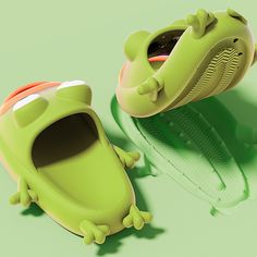 a pair of shoes that look like alligators are laying on the ground next to each other