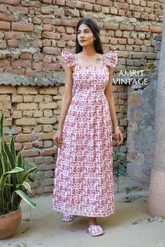 ITEM DESCRIPTION indian red-pink floral pattern printed women's maxi dress - V neckline with tassels cotton long dress Features : short sleeve, square neck, Long dress Fabric: 100% Cotton cambric hand block printed fabrics  Sleeve Length = 6 inch For more sizes & their measurement, please refer our below chart to understand the sizes variations available with us For your size requirement, please mention your size in seller note at the time of buying. SIZE MEASUREMENT  BUSTLENGTHSHOULDER XXS34 in Square Neck Long Dress, Cotton Long Dress, Pink Floral Pattern, Floral Prints Pattern, Block Printing Fabric, V Neckline, Womens Maxi Dresses, Dress Clothes For Women, Dress Fabric