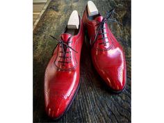 Elevate your shoe game with these bespoke leather handmade shoes. Made with genuine leather, these oxfords come in Red, and are available in all US, UK, EU, and AU sizes. The comfortable insole and standard shoe width make them perfect for any occasion. Designed with a solid pattern and lace-up closure, these handmade shoes are a vintage addition to any wardrobe. The leather outsole adds durability and longevity to these unique boots. Customize them to your liking with personalization options av Luxury Red Oxfords With Goodyear Welt, Luxury Red Oxfords For Derby, Business Red Goodyear Welted Leather Shoes, Red Lace-up Oxfords With Leather Sole, Red Goodyear Welted Dress Shoes, Red Goodyear Welted Oxfords With Round Toe, Red Oxfords With Rubber Sole For Derby, Red Rubber Sole Oxfords For Derby, Classic Red Dress Shoes With Goodyear Welt