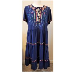 Johnny Was Sicilia Multi-Color Floral Embroidery Tiered Dress Nwt Versatile Stylish Bohemian Dress 100% Authentic Johnny Was Style-J34422-2 Rn#149414 Size - L Approximate Measurements (Taking Flat) Length~44" Shoulders~15" Bust (Pit To Pit)~20" Sleeve~8" Elastic Waist Bottom~44" Material- 100% Cotton Color - Navy With Multi-Color Embroidery A-Line Silhouette Split Neckline Self-Tie Front Short Sleeves Empire Waist Silk Tunic Dress, Embroidered Shirt Dress, Linen Sundress, Linen Tunic Dress, Cozy Dress, Embroidered Lace Dress, Boho Midi Dress, Embroidered Midi Dress, Scoop Neck Dress