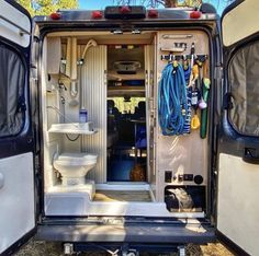 an rv with the door open and it's bathroom inside