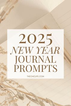 a notepad with the words, new year journal prompts in brown and white