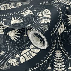 a black and white wallpaper with an intricate design on it's surface,