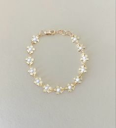 Good daisy chain made with high quality findings Cute White Jewelry With Adjustable Chain, Adjustable White Gold Hypoallergenic Bracelet, Cute White Jewelry For Mother's Day, Cute White Flower Jewelry, White Charm Bracelet With Extender As Gift, Elegant White Bracelets, Hypoallergenic White Chain Bracelet Gift, White Dainty Adjustable Chain Bracelet, White Dainty Bracelets With Adjustable Chain