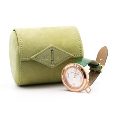 Van Cleef & Arpels Diamond Charms 38mm Women's Watch in 18K Rose Gold With Green Leather Strap. Complete with box and papers.   Rose gold case. Silver face, roman numeral hour markers. Adjustable alligator green leather band, tang clasp. Fixed bezel. Water-resistant up to 30 meters. Quartz movement, round diamonds, guilloché dial, 18k rose gold (Swiss marks), signed Van Cleef & Arpels, Swiss Made, maker's mark, accompanied by a Van Cleef & Arpels 18k rose gold buckle.   This watch is accompanied by the full set of original Van Cleef & Arpels accessories, including box, certificate papers, literature, and a gift bag. Adding a delightful touch to this luxurious offering, the package also features an exclusive assortment of chocolates from La Maison du Chocolat, crafted specifically for Van C Luxury Chronometer Diamond Watch As Gift, Luxury Diamond Watch With Chronometer For Gift, Luxury Diamond Watch With Chronometer As Gift, Luxury Gift Watches With Round Case, Luxury Round Case Watch For Gift, Luxury Round Case Watches For Gift, Luxury Round Case Watch As Gift, Watch Accessories With Diamond Hour Markers For Gifts, Rose Gold Chronometer Watch Accessories As Gift