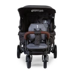 the stroller is black and grey with brown trim