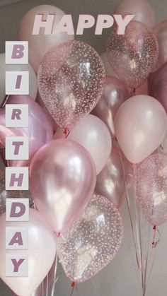 a bunch of balloons with the words happy birthday written on them in pink and white