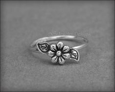 This beautiful ring is made from sterling silver and features a daisy flower with leaves. • sterling silver• flower: 6.3mm• band width: 14g (1.6mm) *This is a clearance item and ready to ship. All sales are final.***********************************************Have a question? Please check out my FAQ page. Adjustable Sterling Silver Promise Flower Ring, Sterling Silver Flower Ring For Wedding, Silver Stackable Flower Ring, Stackable Flower Sterling Silver Ring, Stackable Sterling Silver Flower Ring For Anniversary, Stackable Silver Flower Ring, Sterling Silver Flower Shaped Stackable Rings, Silver Flower Ring For Promise, Silver Promise Flower Ring