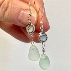 These elegant made to order seafoam sea glass and abalone shell drop earrings feature pieces of sea glass that are beautifully matched in shape, size, and color. A matching necklace can be purchased too either separately or as a set. Each piece is made using genuine sea glass that has been ocean-tumbled. For an idea of size please see photo 4. The necklace hangs on an 18 inch sterling silver chain. The abalone shell is wire wrapped. The ear wires are sterling silver. These sea glass jewelry will Silver Teardrop Sea Glass Jewelry, Elegant Sea Glass Dangle Earrings, Handmade Sea Glass Dangle Jewelry, Handmade Dangle Sea Glass Jewelry, Sea Glass Dangle Earrings Jewelry Set, Sea Glass Dangle Earrings With Matching Set, Handmade Sea Glass Drop Earrings, Sea Glass Dangle Earrings With Ear Wire, Teardrop Sea Glass For Jewelry Making