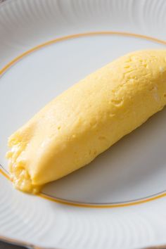 a piece of bread on a plate with the words classic french omelette above it