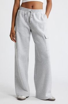 Cargo pockets and wide legs make these fleecy sweatpants right on trend for cool weather and days when you just want to be cozy. 32" inseam; 32" leg opening; 12 1/2" front rise; 13 1/2" back rise (size medium) Elastic/drawstring waist Side flap-patch pockets 68% cotton, 32% recycled polyester Machine wash, tumble dry Imported Not available for sale and shipment to Germany Sweatpants Aesthetic, Cute Sweatpants, Spring Break Outfit, Fall Pants, Cool Weather, Fire Fits, Cute Preppy Outfits, Grey Sweatpants, Wide Legs