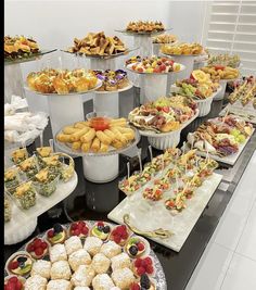 a buffet table filled with lots of food