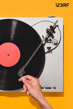 Woman hand turning on vinyl player isolated on yellow background Reading Boards, Christmas Playlist, Christmas Reading, Vinyl Player, Family Project, Lo Fi, Simple Holidays, Free Stock Photos Image, Holiday Entertaining