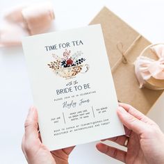 a woman holding up a card that reads time for tea and it's bridal to be