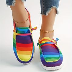 These rainbow striped canvas shoes for women have a lightweight design that provides both comfort and versatility, making them the perfect walking shoes. Made of breathable canvas, they are ideal for a variety of activities, whether it's a daily walk or a hike across challenging terrain. Item ID : TW16224 Patterned : Other Material : Canvas Toe Style : Round toe Trendy Multicolor Canvas Shoes With Vulcanized Sole, Trendy Multicolor Canvas Shoes With Rubber Sole, Multicolor Slip-on Canvas Shoes For Summer, Casual Multicolor Slip-on Canvas Shoes, Summer Multicolor Lace-up Canvas Shoes, Comfortable Multicolor Flat-heel Sneakers, Multicolor Textile Canvas Shoes With Rubber Sole, Sporty Multicolor Canvas Shoes For Summer, Multicolor Canvas Sneakers For Summer