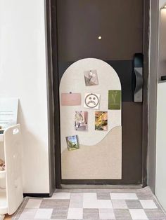 an open door with pictures on it and magnets attached to the front doors,