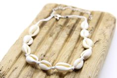 Handmade cowrie shell choker.  Adjustable (33-38cm) and made from cowrie shells on white waterproof cord.  Cowrie shells measure 17 x12 mm. 🌊 🏊✅ Pool & ocean proof.  📦✅ Shipped FREE in the UK and dispatched on the SAME DAY where possible. 🎁✅ Gift wrap option available.  Visit our Etsy site to view other Ben's Beach jewellery --> https://www.etsy.com/uk/shop/BensBeach 🌐 Visit our main site --> https://bensbeach.com/ to view our wider selection and subscribe for updates (we do not spam) re new jewellery and offers. Follow Ben on Instagram & Pinterest:  https://www.instagram.com/bensbeachjewellery/  https://www.pinterest.co.uk/6fccf3766a7720fb9faddadb150933/  See what other customers think of Ben's Beach by checking our reviews on Trust Pilot. https://uk.trustpilot.com/review/bensbeach.c White Shell Choker As A Gift, White Shell Choker Necklace For Summer, White Shell Strand Necklace For Summer, White Strand Shell Necklace For Summer, White Handmade Shell Necklace For Festivals, Handmade White Shell Necklace For Summer, White Shell Necklace For Summer Festivals, Handmade White Choker For Vacation, Handmade White Shell Necklace For Festivals