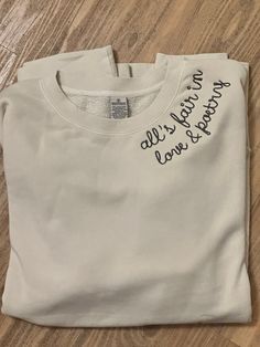 a white t - shirt with writing on it