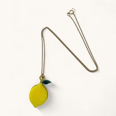 Brighten up your day with our Lemon Charm Necklace, adding a zesty touch to your style when life gives you lemons! The viibrant fruit necklace features layers of laser-cut glossy yellow and metallic gold acrylic, complemented by a marbled green leaf. Choose from either a sterling silver or gold filled chain to suit your mood! Handcrafted in our London studio, the lemon necklace will arrive beautifuly packaged, making for an exquisite gift and thoughtful gift for any fruit lover! Fruit Necklace, Guinea Bissau, Gold Filled Chain, Mozambique, Gold Metal, Gold Filled, Charm Necklace, Thoughtful Gifts, Chain