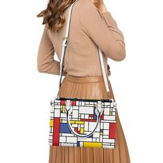 • Step into the world of art and fashion with our Mondrian Handbag, featuring a striking Mondrian Print that pays homage to the iconic artist.• Embrace retro vibes with this Mod Bag, inspired by 60s style and designed to make a statement wherever you go.• Elevate your ensemble with our Vintage Style Handbag, crafted with geometric patterns in vibrant white, red, and blue hues.• Enjoy versatility and convenience with the removable strap and exquisite zipper detailing of this Vintage Style Purse.• Modern Multicolor Top Handle Box Bag, Modern Multicolor Satchel With Detachable Handle, Modern Double Handle Box Bag As Gift, Modern Double Handle Box Bag For Gift, Modern Red Rectangular Satchel, Retro Square Satchel For Office, Modern Multicolor Shoulder Box Bag, Modern Red Tote Box Bag, Modern Multicolor Rectangular Shoulder Bag