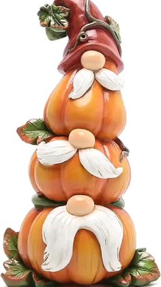 an orange and white figurine is stacked on top of each other