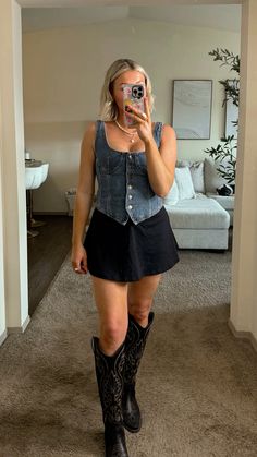 Jean top | black mini skirt | cowgirl boots Cowgirl Outfits With Black Boots, Cowgirl Boots Skirt Outfit, Black Skirt And Cowboy Boots Outfit, White Dress Black Cowboy Boots, Western Mini Skirt Outfit, Black Dress And Cowgirl Boots, Tall Black Cowgirl Boots Outfit, Black Skirt Cowboy Boots Outfit, Black Cowboy Boots Outfit Going Out