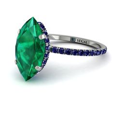 With timeless style and a luxurious look, this Hidden Halo Marquise Emerald Engagement Ring is the most fashionable thing you can wear. This Hidden Halo Marquise Emerald Engagement Ring is a thin band with a marquise Emerald center stone and round stones covering the rest of the band. Stock Number: 7163 Metal Setting Metal Type: 14K White Gold Main Stone Type: 100% Natural Green Emerald Size: 2.5Ct / 14 x 7.5mm Shape: Marquise Cut Color: Green Clarity: SI (Eye Clean) Additional Stones Stone Type Hidden Halo Marquise, Gold Engagement Rings Unique, Halo Marquise, Halo Engagement Ring Emerald, Emerald Engagement Rings, Engagement Rings Gold, Elegant Engagement Ring, Rings White Gold, Vintage Inspired Engagement Rings