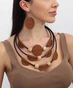 Hand made leather jewelry set Elegant Brown Jewelry For Everyday Use, Brown Wooden Beads Jewelry, Brown Wooden Beads Round Jewelry, Handmade Brown Jewelry For Everyday Use, Earthy Brown Handmade Jewelry, Brown Round Wooden Beads Jewelry, Adjustable Brown Necklaces, Brown Leather Necklace For Gifts, Brown Artisan Jewelry For Everyday