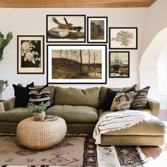 a living room filled with lots of furniture and pictures on the wall above it's couch