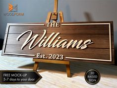 a wooden sign that says the williamss est 2093 with an easel next to it