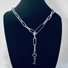 Welcome to my shop.  This Lariat Necklace is handmade by me and is custom made to order. This Necklace does not change colour as all components are made with stainless steel. Dimensions: CHAIN: 16 x 7mm (approximate) KEY CHARM: 25 x 10mm THE LENGTH IS MEASURED ONLY BY THE CHAIN. LENGTH DOES NOT INCLUDE THE KEY. You may also like similar lariat necklaces: https://www.etsy.com/uk/listing/1420737064/blue-evil-eye-lariat-necklace-y-drop https://www.etsy.com/uk/listing/1410718288/y-chain-drop-necklac Silver Lariat Chain Necklace Gift, Lariat Charm Necklaces With Lobster Clasp As A Gift, Silver Lariat Necklace With Paperclip Chain For Gift, Gift Lariat Charm Necklace With Lobster Clasp, Silver Chain Necklace With Paperclip Shape For Gift, Silver Chain Paperclip Necklace For Gift, Gift Lariat Chain Necklace With Lobster Clasp, Paperclip Shape Silver Chain Necklace For Gift, Lariat Chain Necklace As A Gift