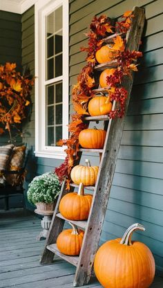 an old ladder is used as a fall decoration