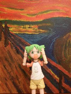 a toy doll is standing in front of a painting that looks like it has green hair