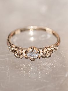 ✪ Limited Edition. Named after the botanical Goddess of flowering plants, the Flora ring symbolizes... Rose Gold Flower Ring With Center Stone For Promise, Delicate Rose Cut Promise Diamond Ring, Promise Rose Cut Diamond Flower Ring, Promise Flower Ring With Rose Cut Diamonds, Delicate Promise Ring With Rose Cut Diamonds, Ethereal 14k Gold Rings With Rose Cut Diamonds, Ethereal 14k Gold Wedding Rings, Ethereal Wedding Rings With Rose Cut Diamonds, Delicate White Gold Rings With Rose Cut Diamonds