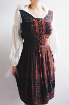 Step back into the '90s with this stunning vintage brown embroidered rayon dress. This dress isn't just a piece of clothing; it's a time machine to the era of 90s bliss and whimsigoth vibes. With its intricate embroidery and earthy tones, it's a perfect blend of hippie and artsy styles. Whether you're headed to a festival or just want to stand out with some retro charm, this dress has got you covered. Embrace the whimsy of the '90s with this unique, one-of-a-kind piece. Hurry, before it's gone faster than your favorite '90s jam on a mixtape!  Material: viscose Size: Not stated (free size), best fit is a femme medium- approximately a size 8-10 Condition: 10/10, no apparent flaws Color: chestnut brown If you have any questions please feel free to contact me, I would love to hear from you! Vintage Dresses For Halloween Alternative Fashion, Vintage Dresses For Halloween And Alternative Fashion, Gothic Brown Corset Dress For Costume Party, Brown Gothic Corset Dress For Costume Party, Vintage Brown Dress For Costume Party, Sleeveless Vintage Dress For Fall, Fitted Brown Dress For Festival, Festive Brown Dress With Intricate Embroidery, Cottagecore Fitted Costume Dress