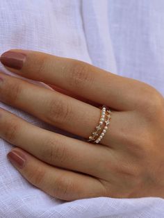 Make a statement with our Star Accented Pearl Ring, a perfect blend of celestial charm and classic elegance featuring a series of pearls interspersed with star-shaped zirconia accents, all set in a radiant gold-plated band.  💖Perfect for everyday wear or as a statement piece for special occasions, this ring also makes a memorable gift for those who appreciate a touch of celestial magic--ideal for anniversaries, birthdays, or simply to show someone you care. ✨Specifications: - Size: Adjustable ( Classic Gold Sparkling Rings, Sparkling 14k White Gold Jewelry, Classic Sparkling 14k Gold Jewelry, Celestial Yellow Gold Stackable Jewelry, Dainty Sparkling Yellow Gold Jewelry, Minimalist Sparkling Yellow Gold Jewelry, Delicate Sparkling Yellow Gold Jewelry, Sparkling 14k Gold Wedding Jewelry, Dainty Sparkling 14k Gold Jewelry